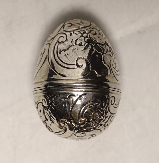 An engraved white metal egg shaped nutmeg grater, 40mm.